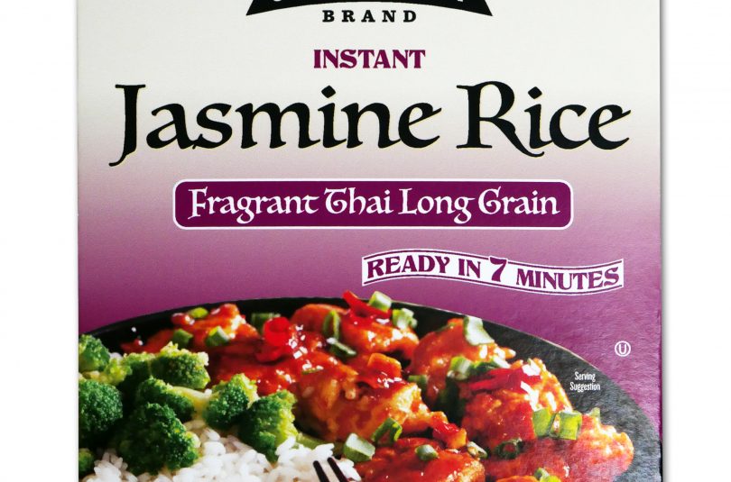 Purple package of Jack Rabbit Brand Instant Jasmine Rice. The box reads, "Gluten Free - Non-GMO - Precooked, Jack Rabbit Brand Instant Jasmine Rice, fragrant Thai long grain, ready in 7 minutes." The box has an image of a Thai rice dish with meat and broccoli.