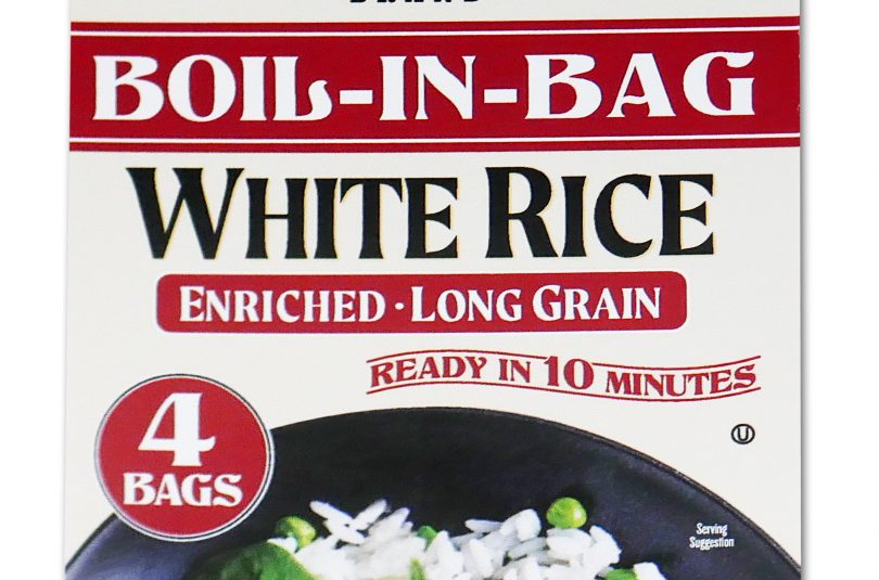 Red package of Jack Rabbit Brand Boil-In-Bag White Rice. The box reads, "Gluten Free - Non-GMO - Precooked, Jack Rabbit Brand Boil-In-Bag White Rice, enriched - long grain, ready in 10 minutes." The box has an image of a white rice dish with meat and peas.